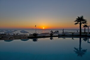 Seasonal outdoor pool, pool umbrellas, sun loungers