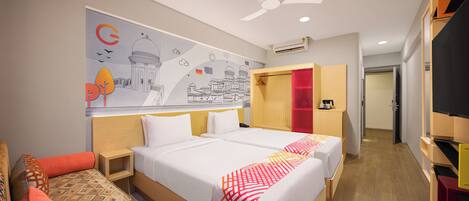 A hotel room with two beds, a ceiling fan, an air conditioning unit, and a wall mural.