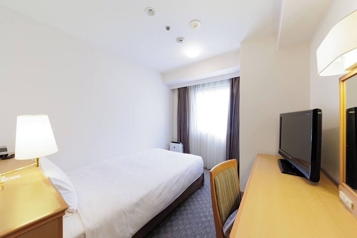 Premium bedding, down duvets, in-room safe, desk