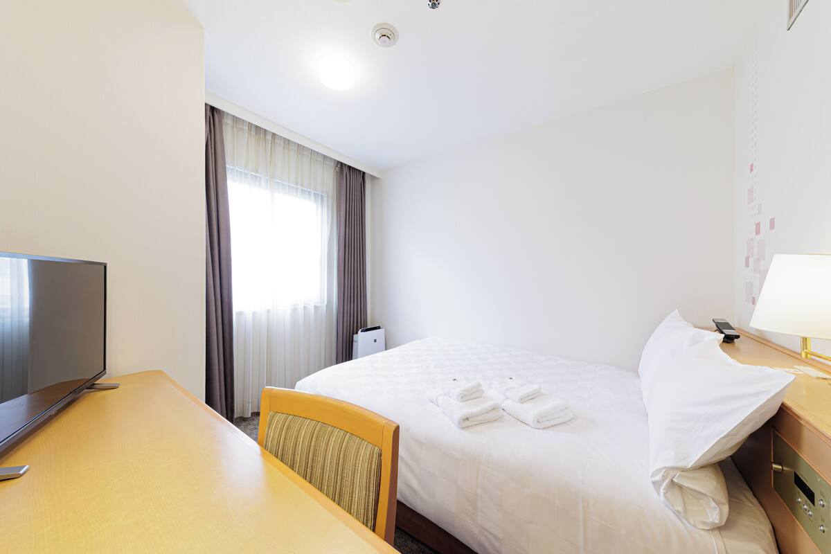 Premium bedding, down duvets, in-room safe, desk