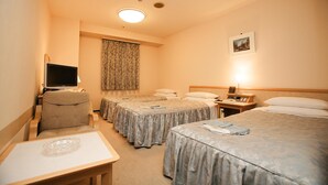 A hotel room with two single beds, a desk, a chair, a television, and a lamp. - Narita U-City Hotel (Narita)