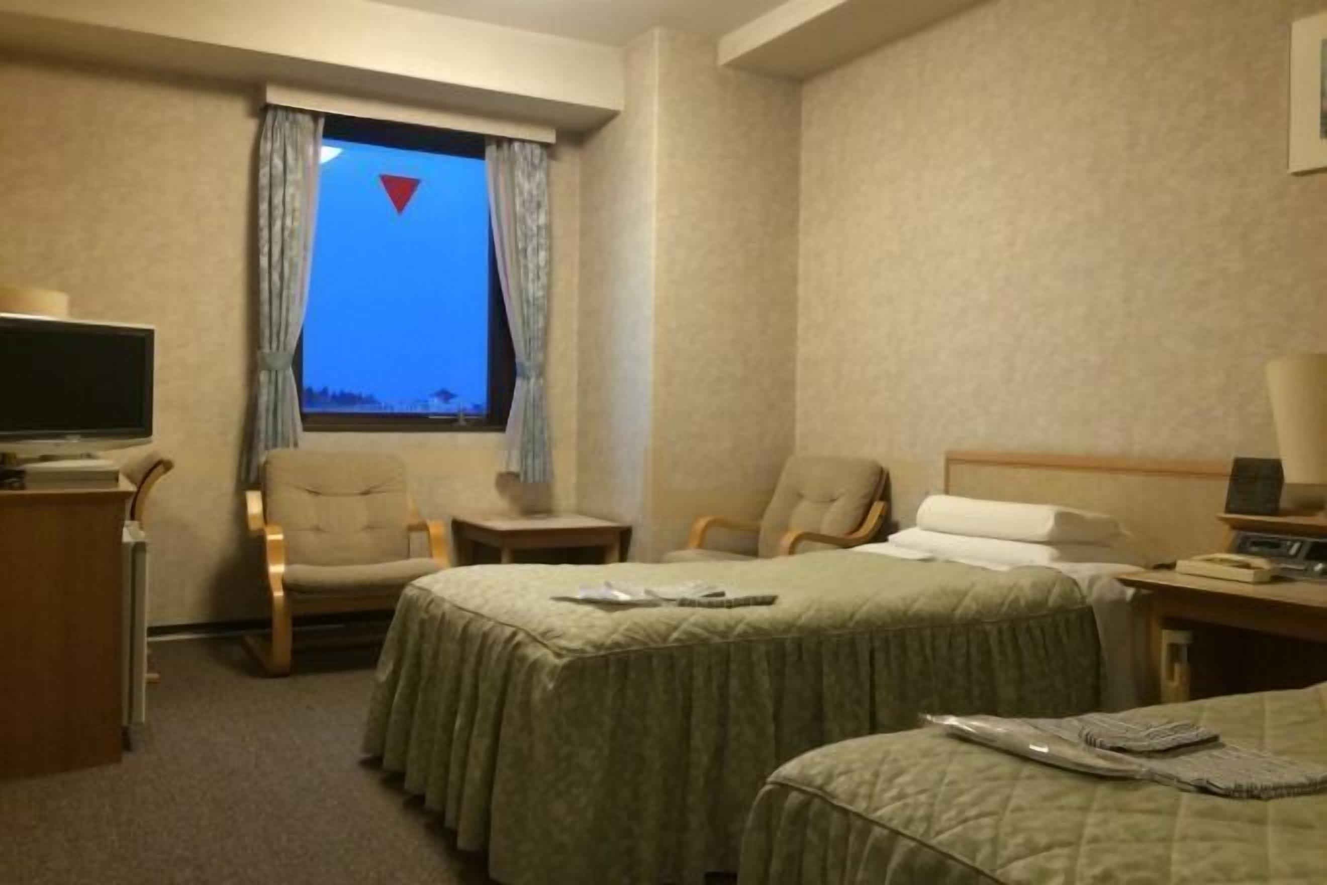 Down comforters, desk, blackout drapes, iron/ironing board