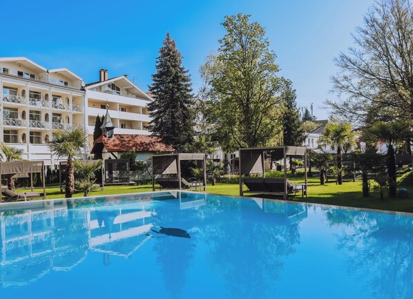 Indoor pool, outdoor pool, pool umbrellas, pool loungers