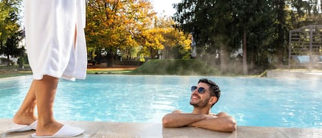 Indoor pool, outdoor pool, pool umbrellas, pool loungers