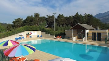 Outdoor pool, open 9:30 AM to 8:00 PM, pool umbrellas, pool loungers