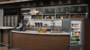 A modern bar area with a marble countertop, a cash register, and a refrigerated display case with beverages. - Courtyard Phoenix Chandler/Fashion Center (Chandler)