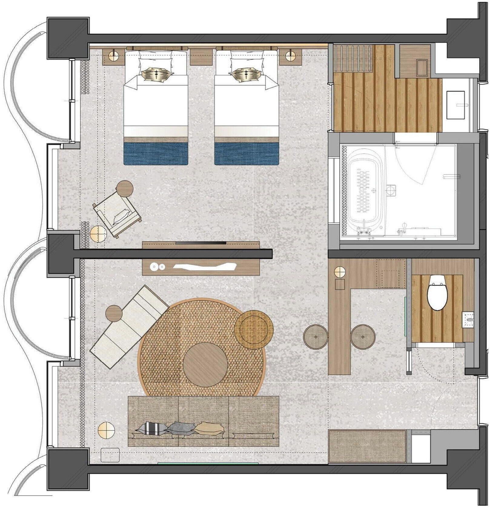 Un plan d’étage d’une chambre d’hôtel comprenant un lit, un coin salon avec une table et des chaises, un petit coin cuisine et une salle de bain.