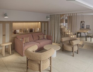 Habitación, varias camas, vistas al mar | Zona de estar | Una televisión de pantalla plana