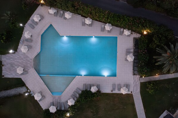 Seasonal outdoor pool, open 10:00 AM to 8:00 PM, pool umbrellas