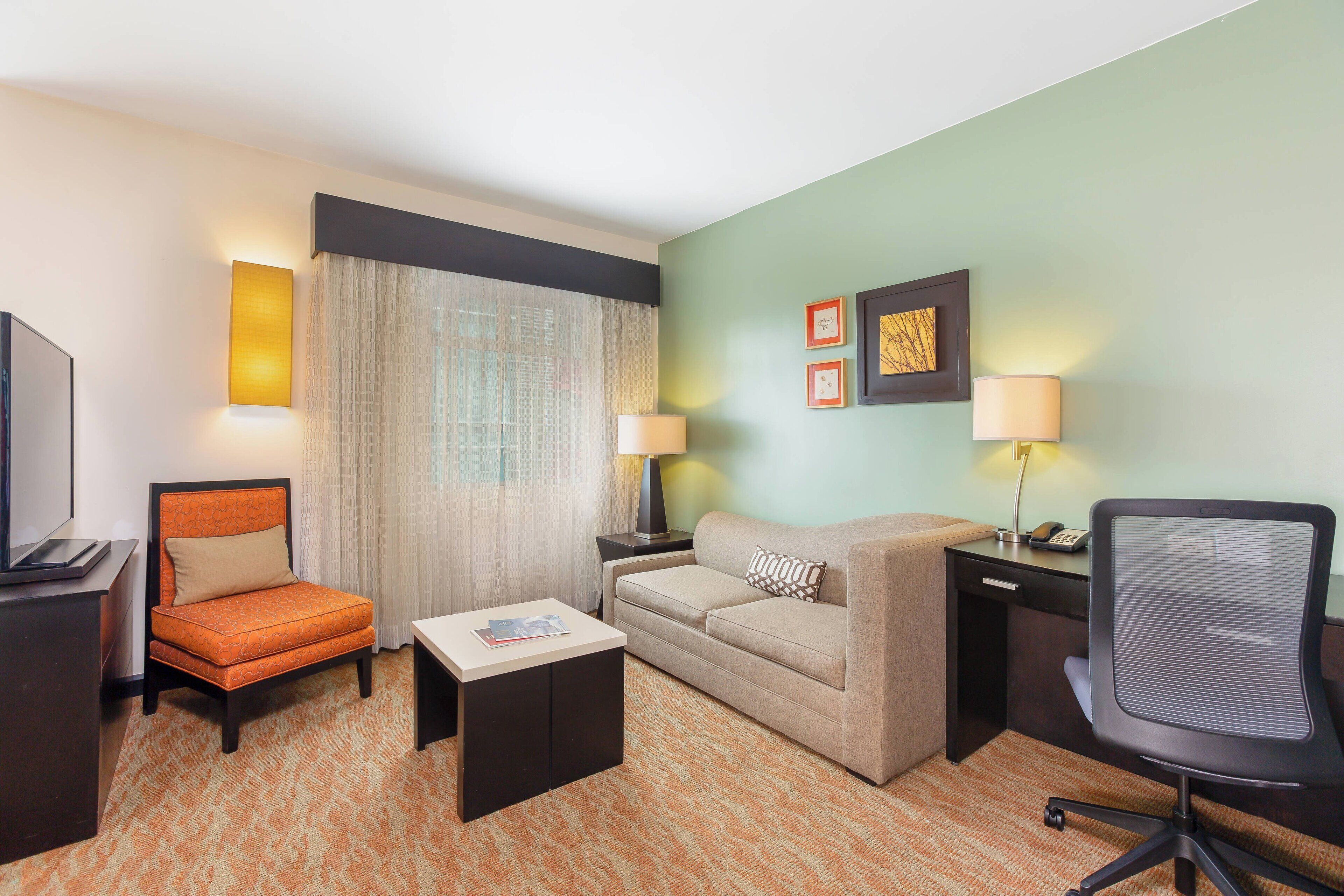 studio, 1 queen bed with sofa bed | living area | flat-screen tv