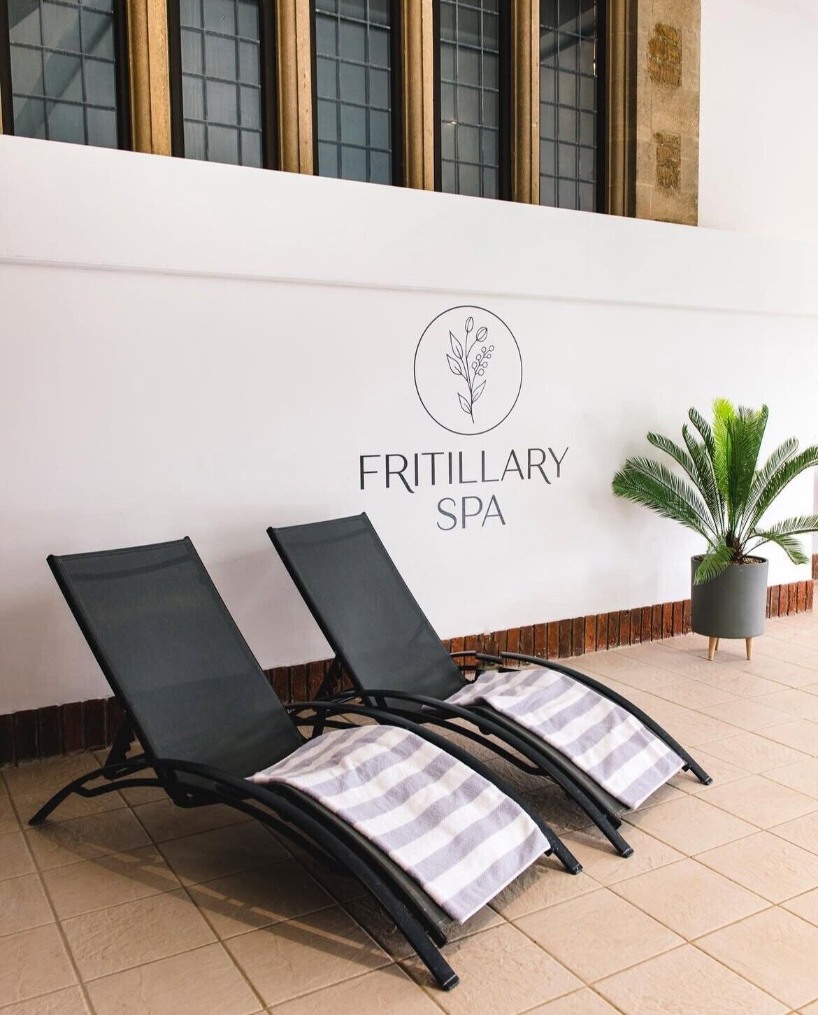 Indoor pool, open 6:00 AM to 10:00 PM, pool loungers