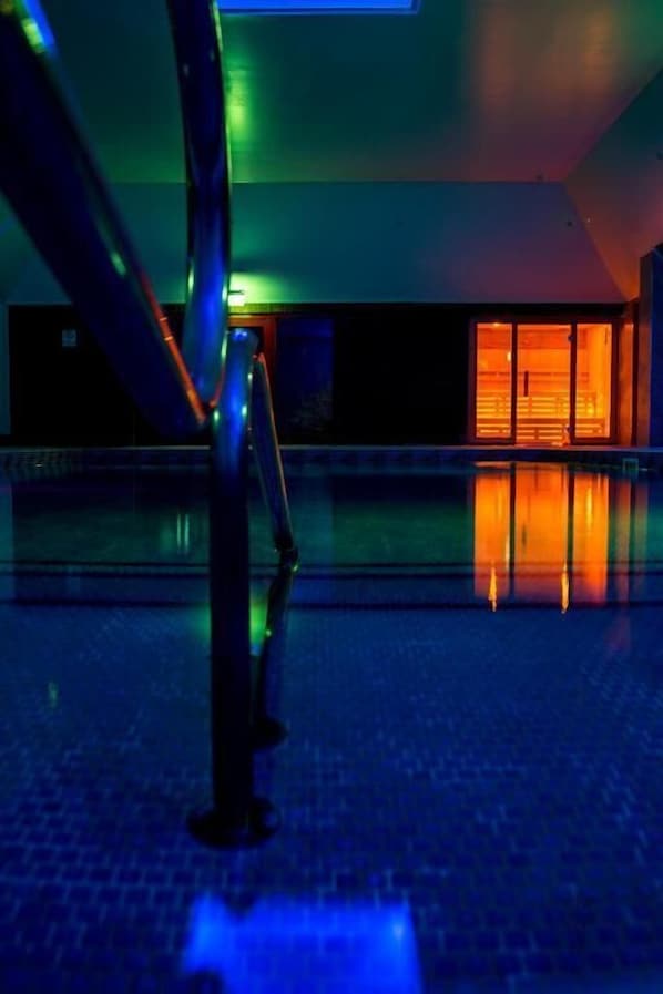 Indoor pool, open 6:00 AM to 10:00 PM, pool loungers