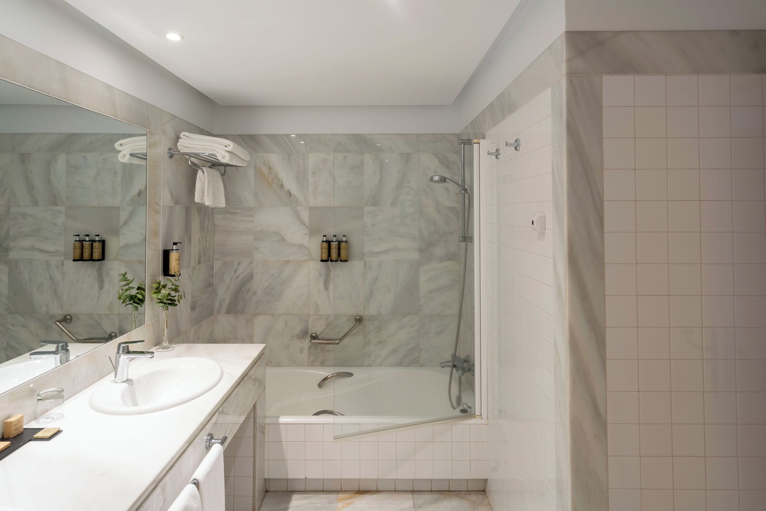 deep-soaking bathtub, eco-friendly toiletries, hair dryer, bidet