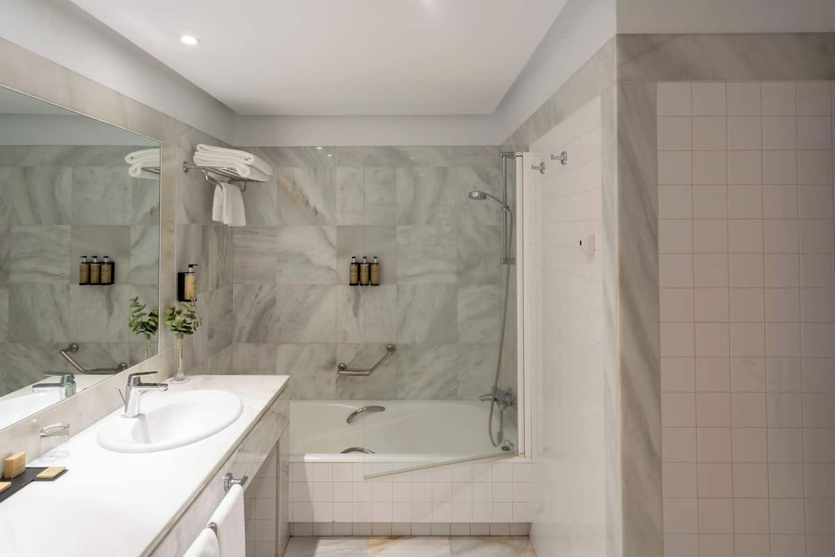 deep-soaking bathtub, eco-friendly toiletries, hair dryer, bidet