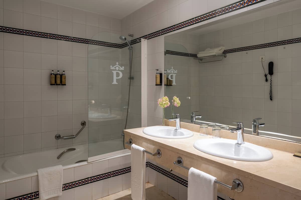 deep-soaking bathtub, eco-friendly toiletries, hair dryer, bidet