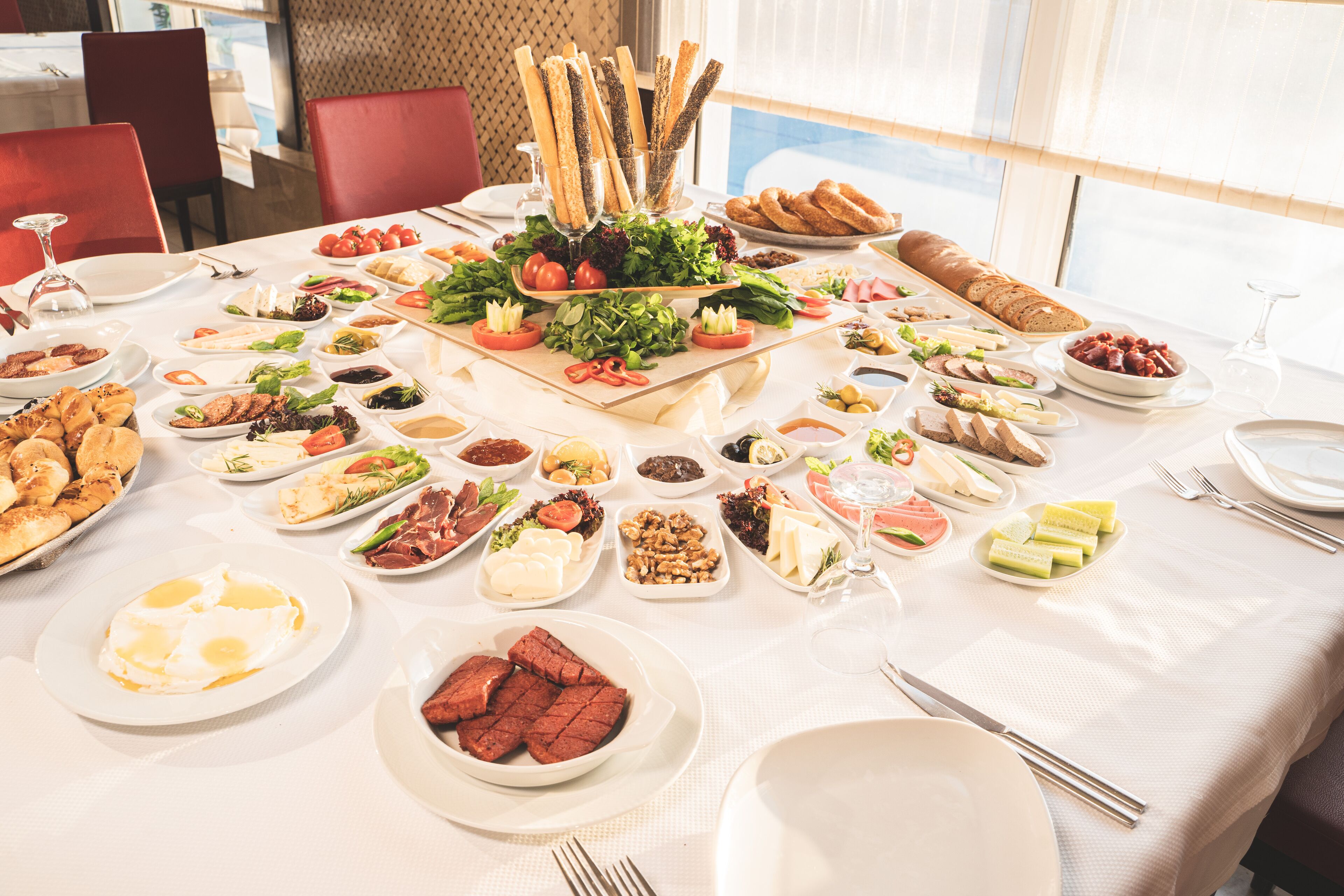 A table set for a meal with various dishes and utensils.