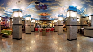 A lobby with a polished floor, a reception desk, and a ceiling with a cloud mural. - Hotel Buyuk Keban (Istanbul)