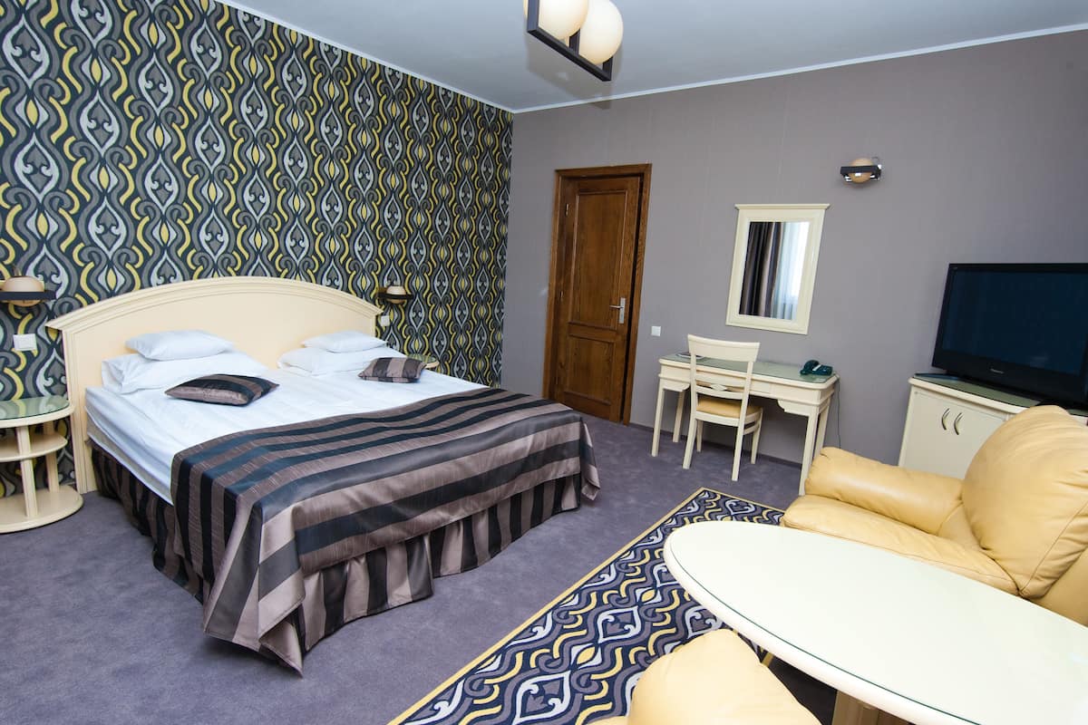 Suite, 1 chambre | Minibar, coffre-fort, fer et planche à repasser