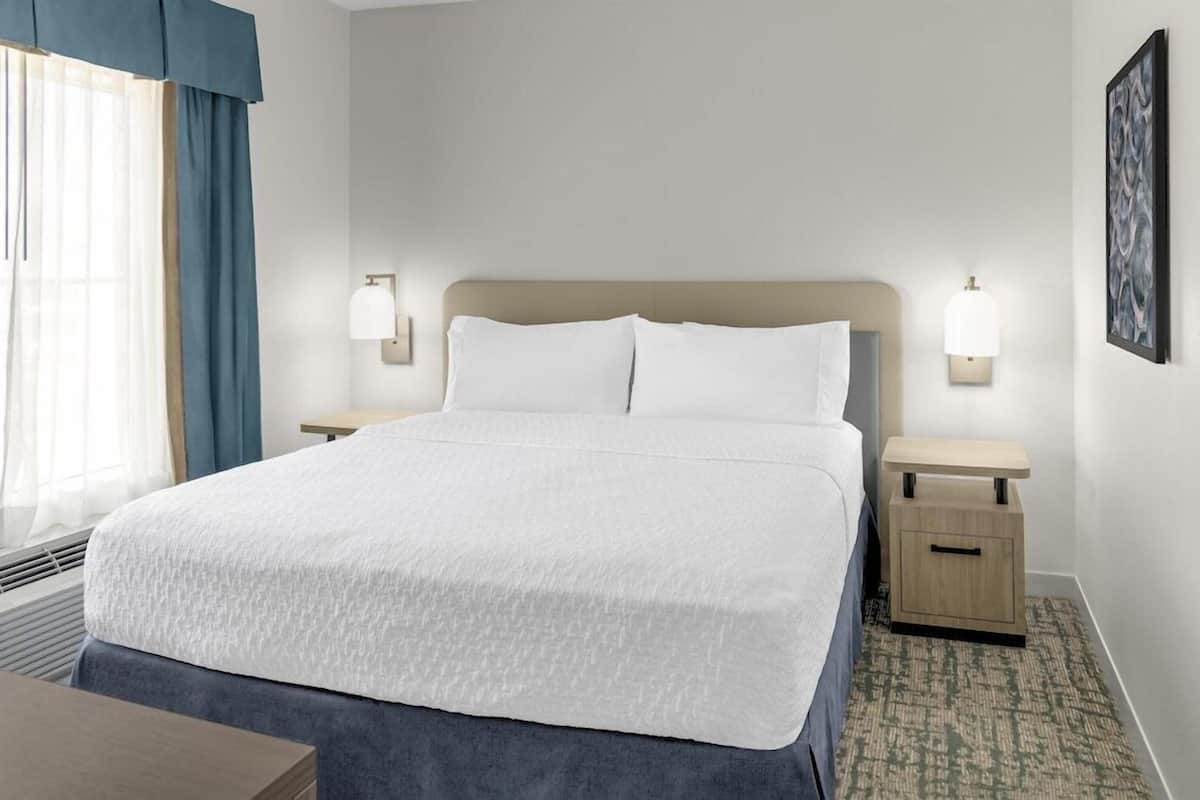 Hypo-allergenic bedding, desk, blackout drapes, iron/ironing board