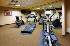 A gym with treadmills, elliptical machines, and stationary bikes. - Holiday Inn Express Hotel & Suites FRESNO NORTHWEST-HERNDON by IHG (Fresno)