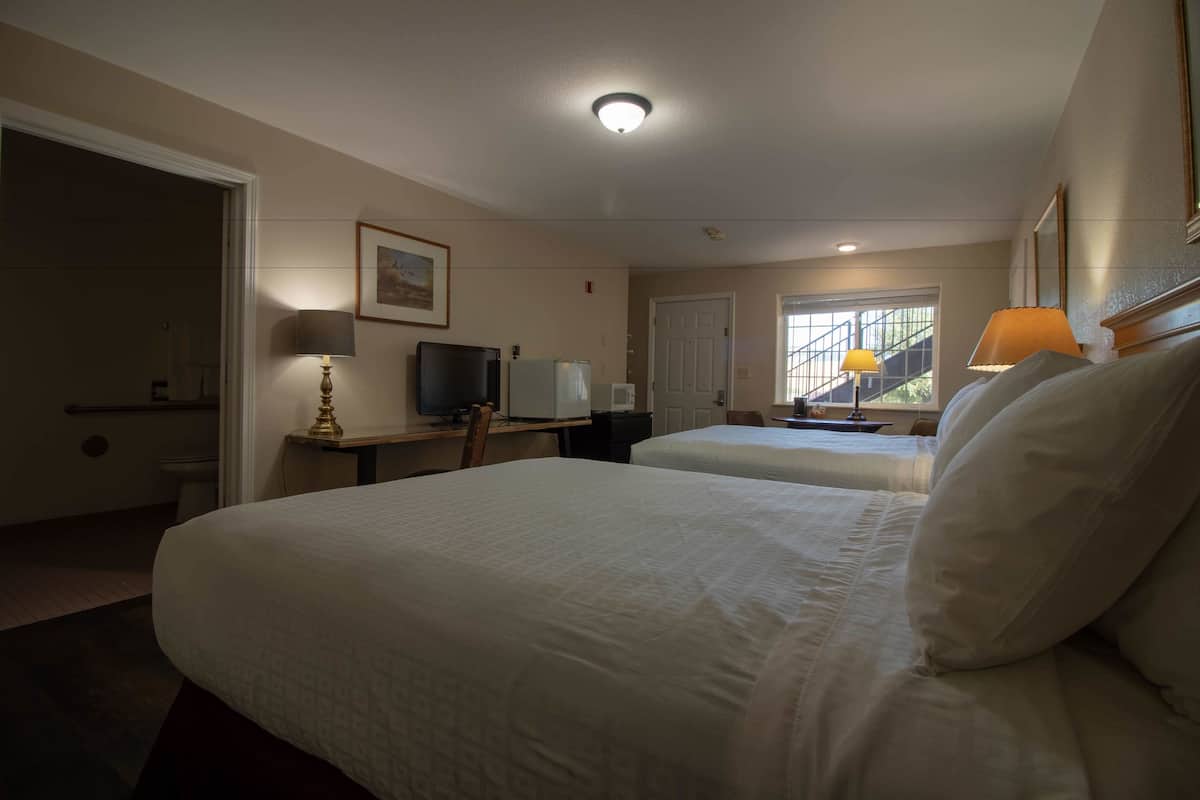 Pillow-top beds, desk, blackout curtains, iron/ironing board