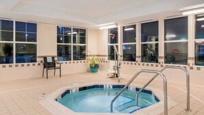 A swimming pool with a no diving sign, a chair, and a potted plant. - Residence Inn by Marriott Harrisonburg (Harrisonburg)