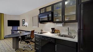 A compact kitchen with a microwave, sink, and refrigerator. - Candlewood Suites Sumter by IHG (Sumter)