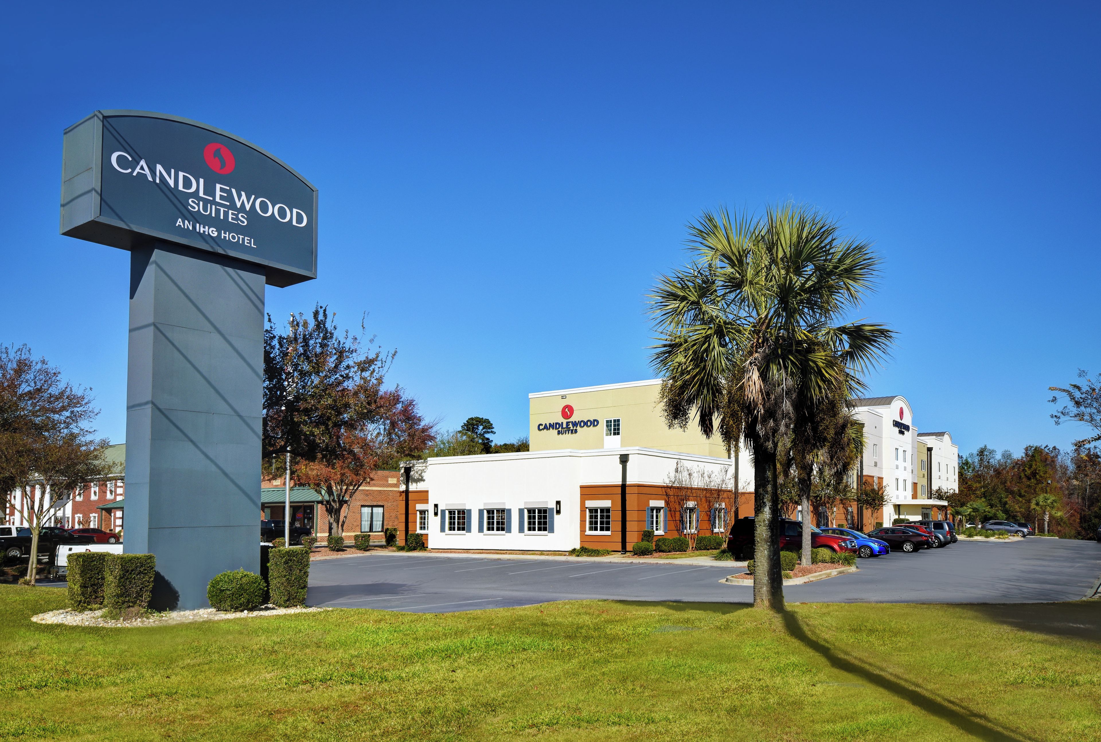 A hotel sign for Candlewood Suites in IHG Hotel.