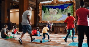 Guests can enjoy a peaceful atmosphere in this public space, surrounded by a large painting and patterned tiles.