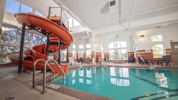 Enjoy a fun and safe swim in our indoor pool with a water slide and lounge chairs.