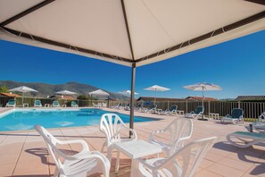 Seasonal outdoor pool, pool umbrellas, pool loungers