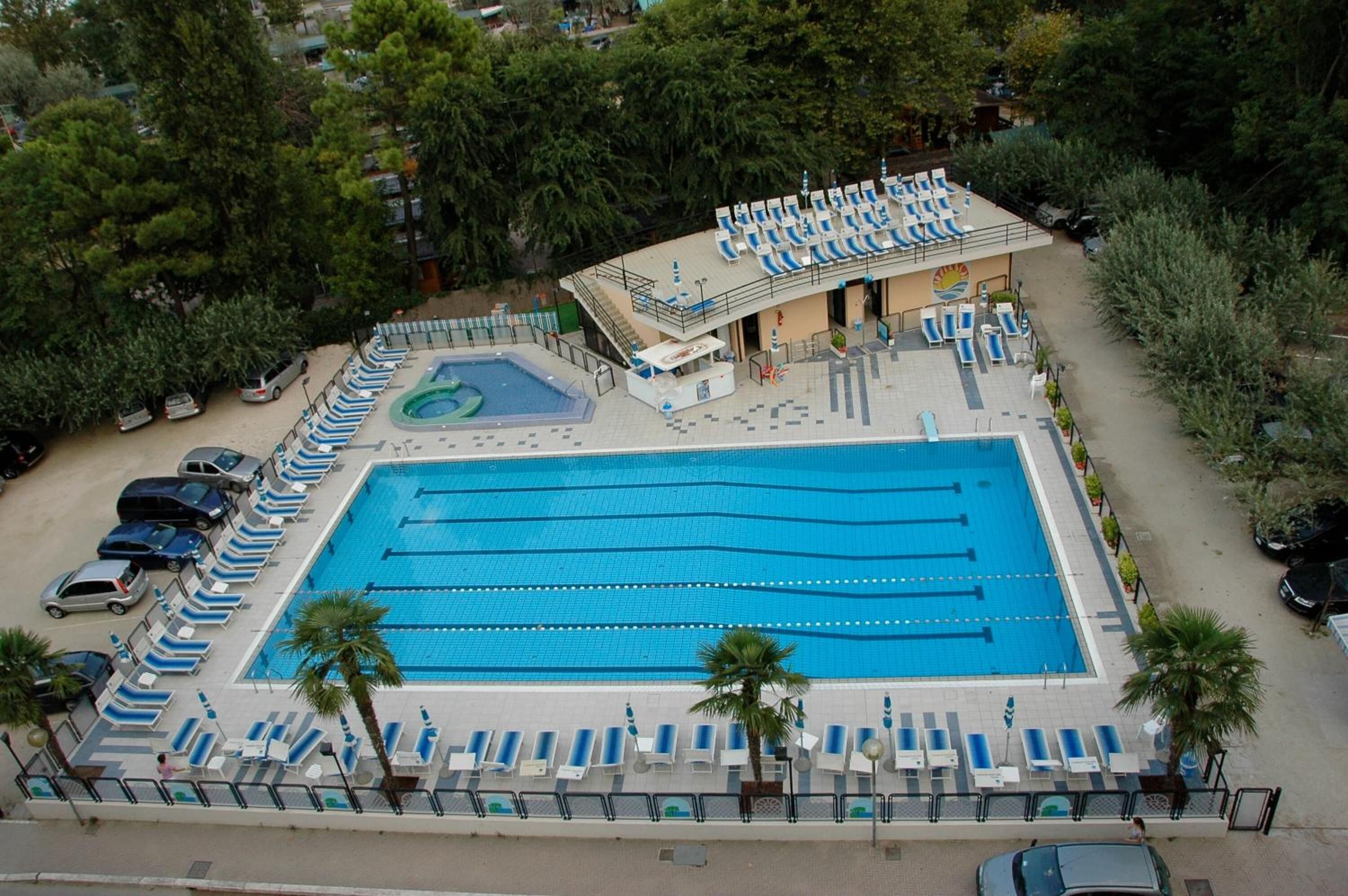 outdoor pool, open 9:00 am to 6:30 pm, pool umbrellas