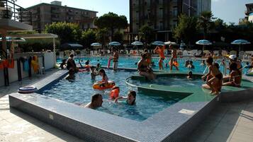 Outdoor pool, open 9:00 AM to 6:30 PM, pool umbrellas