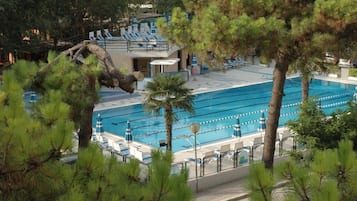 Outdoor pool, open 9:00 AM to 6:30 PM, pool umbrellas