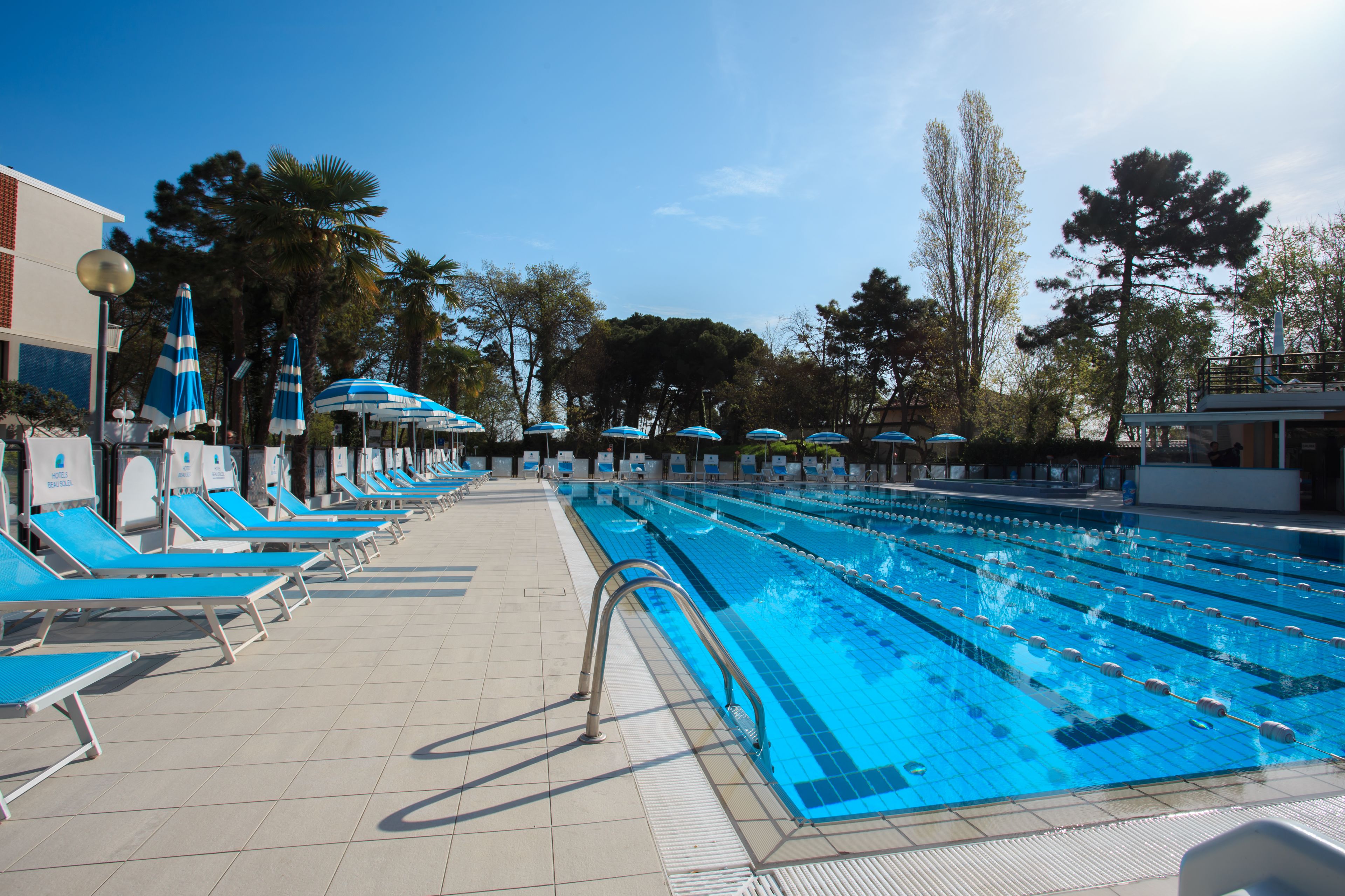 outdoor pool, open 9:00 am to 6:30 pm, pool umbrellas