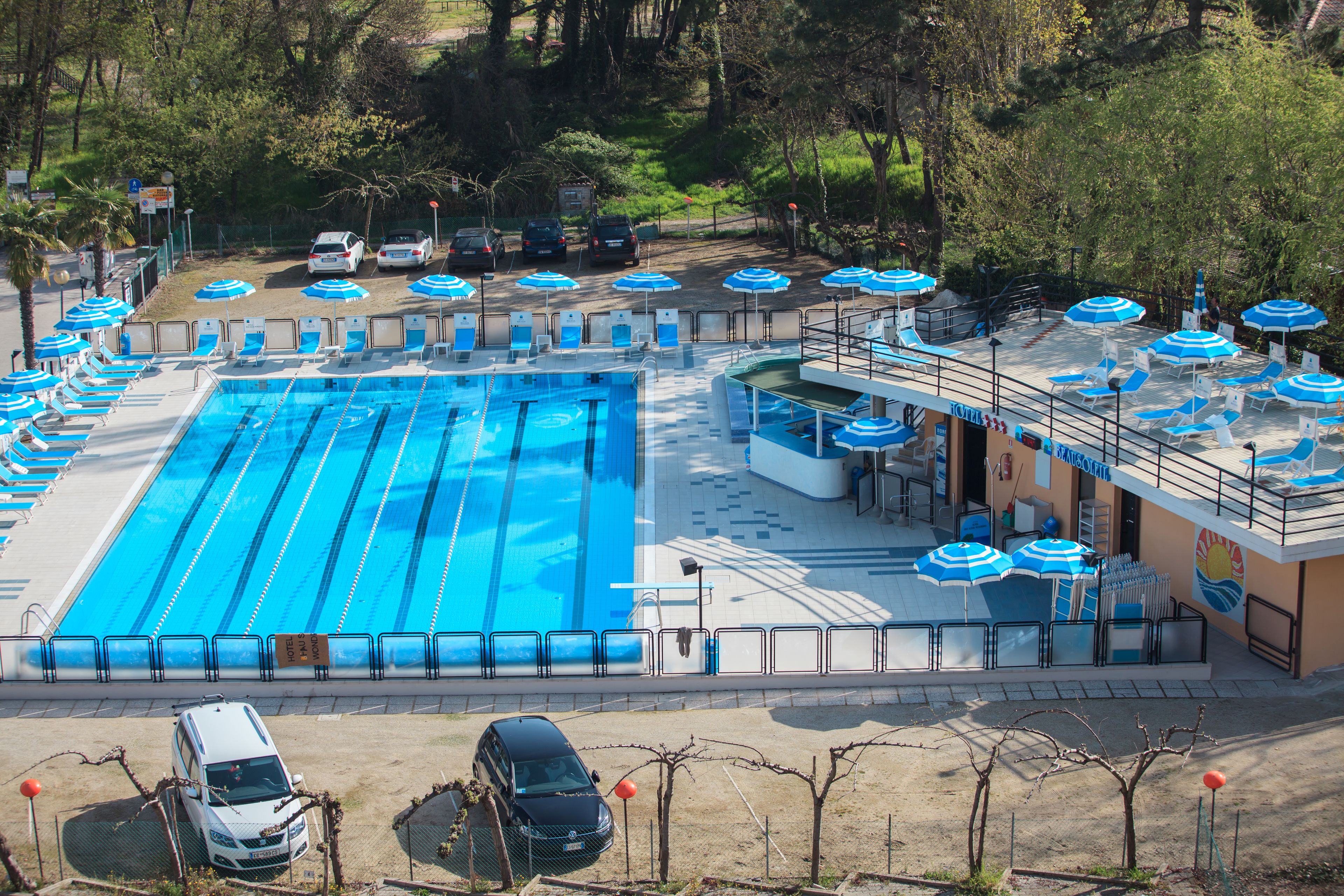 outdoor pool, open 9:00 am to 6:30 pm, pool umbrellas