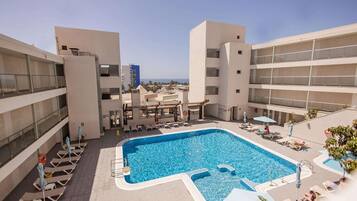 Outdoor pool, pool umbrellas, pool loungers