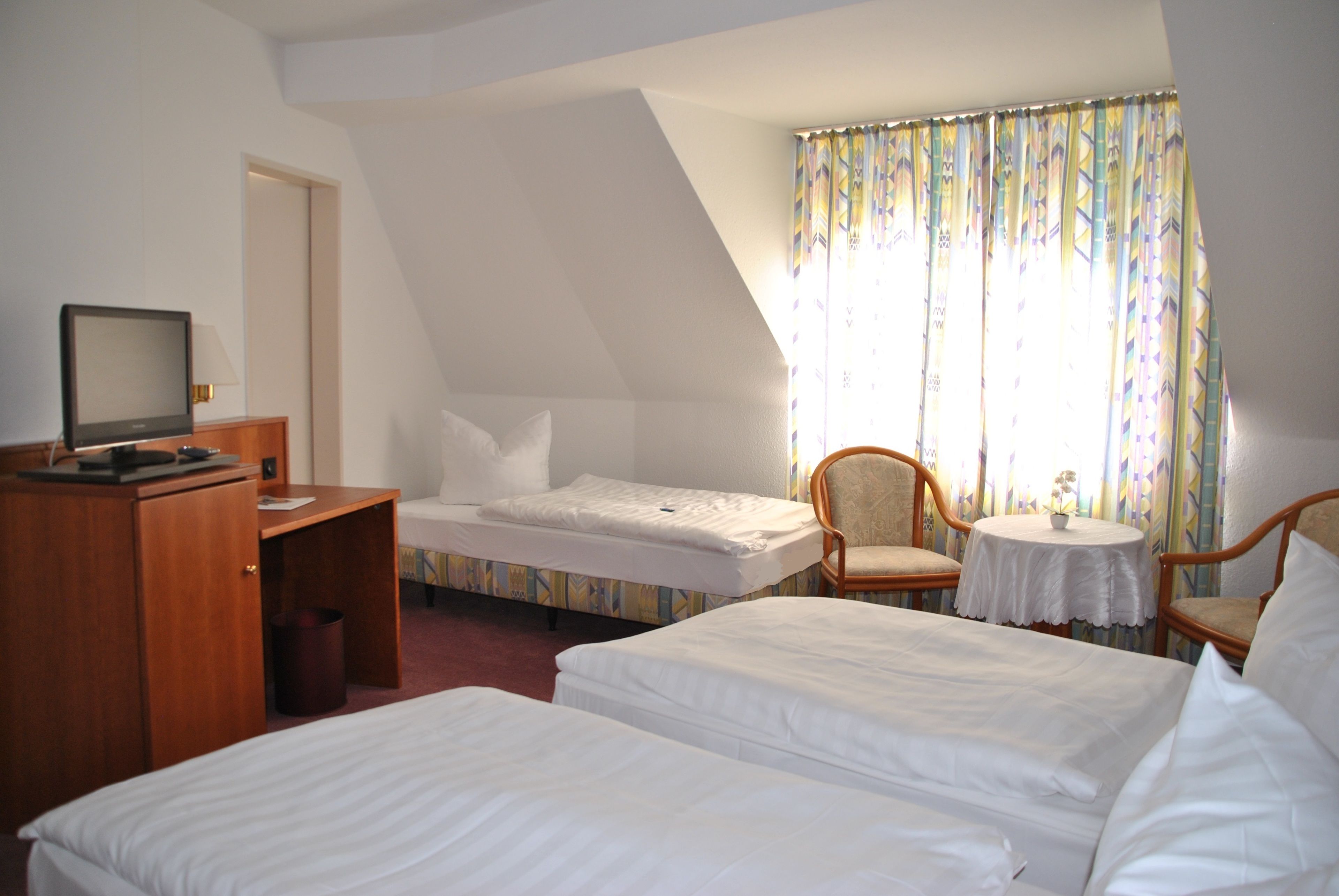 comfort triple room, non smoking, valley view | minibar, desk, laptop workspace, blackout curtains