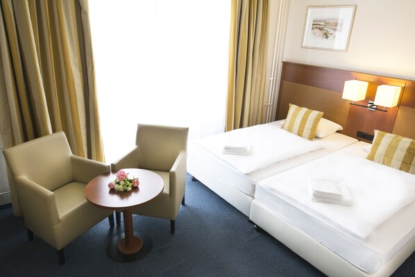 Een kluis op de kamer, verduisterende gordijnen, gratis wifi, beddengoed