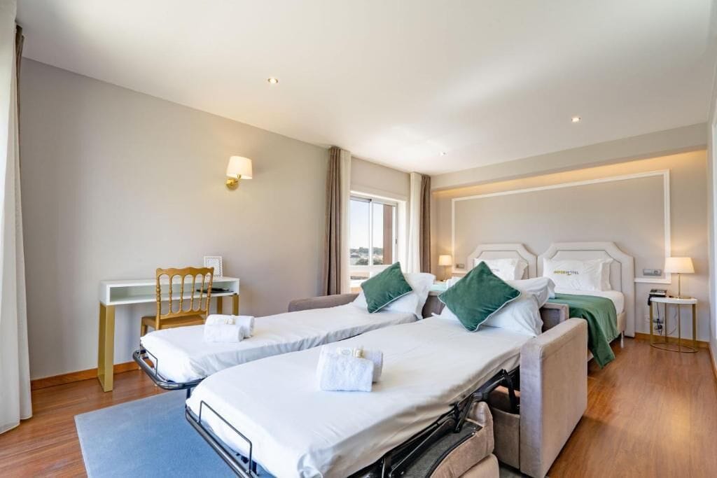 basic quadruple room, city view | desk, free wifi, bed sheets