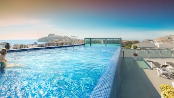 Indoor pool, outdoor pool, pool umbrellas, pool loungers