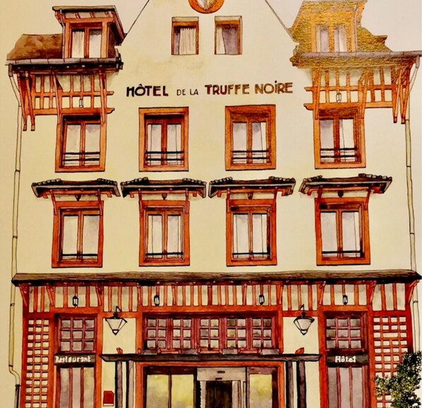Un edificio con un letrero que dice "HOTEL DE LA TRUFFE NOIRE".
