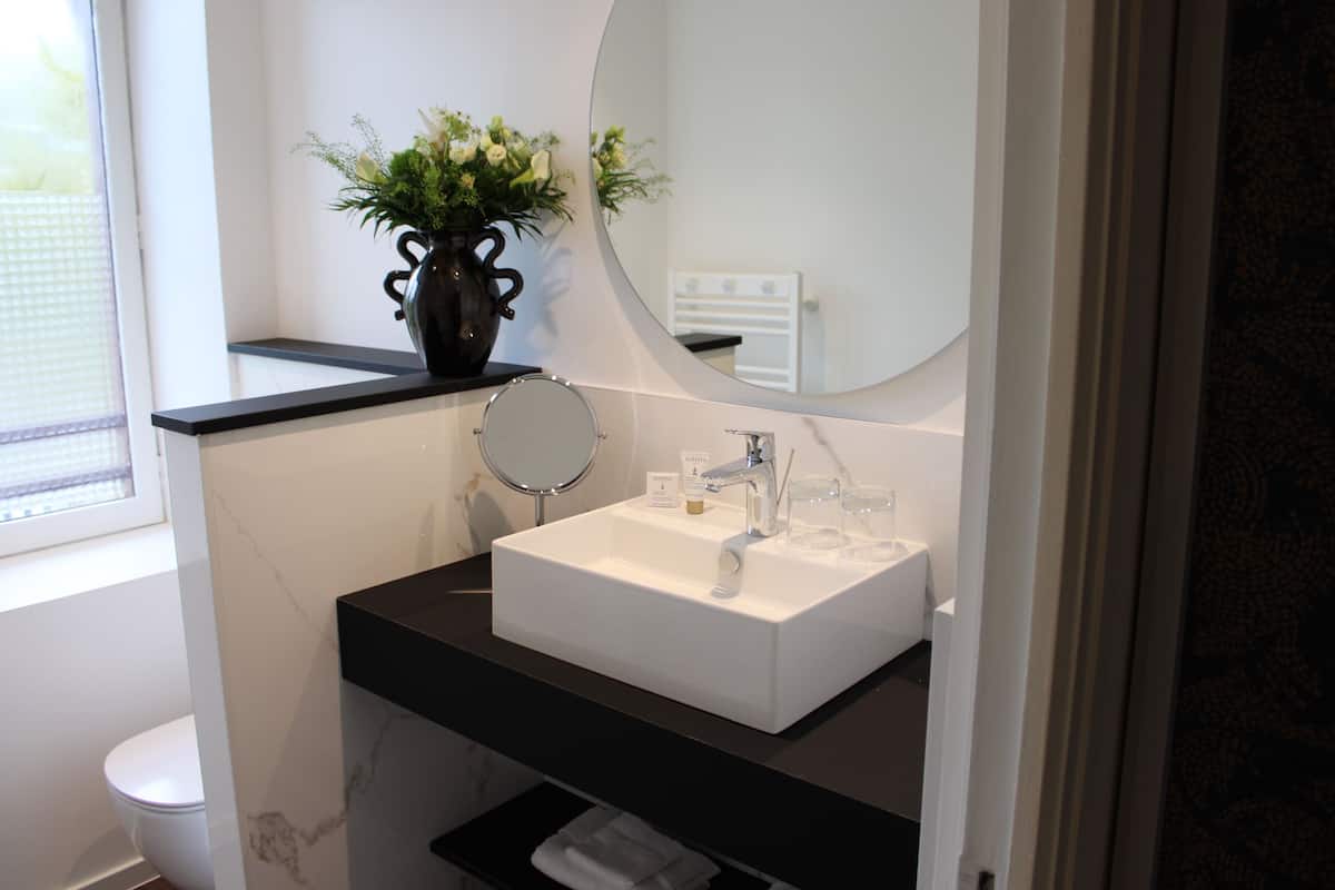 superior room | bathroom | rainfall showerhead, hair dryer, bathrobes, towels