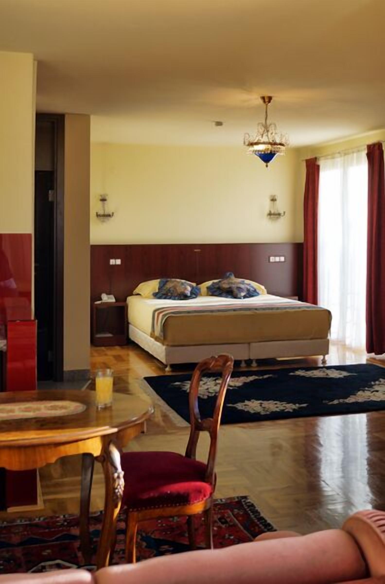 superior room, multiple beds, courtyard view | living area | tv, dvd player