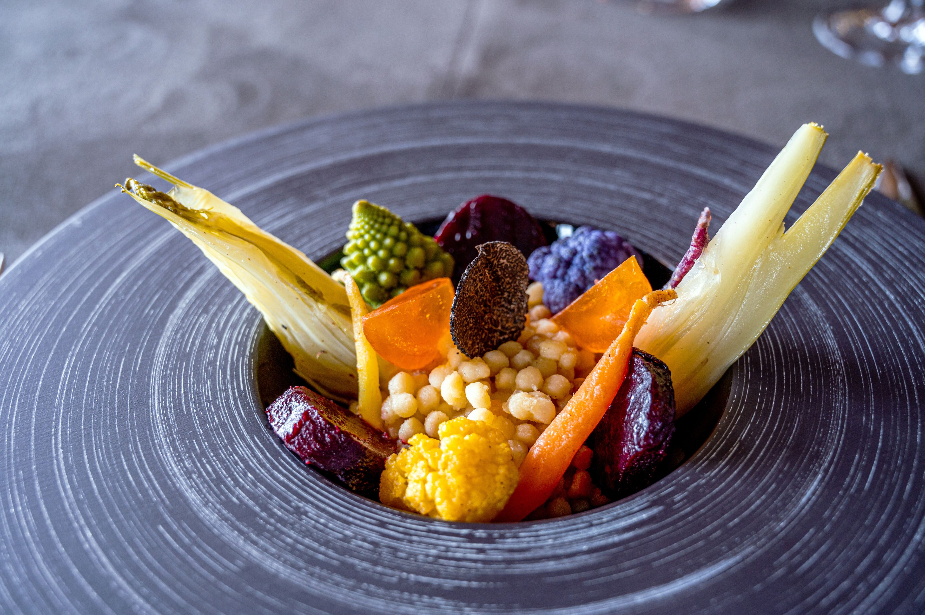 A plate of assorted vegetables and grains.