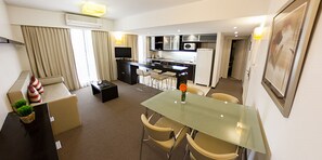 Fridge, microwave, coffee/tea maker, cookware/dishes/utensils