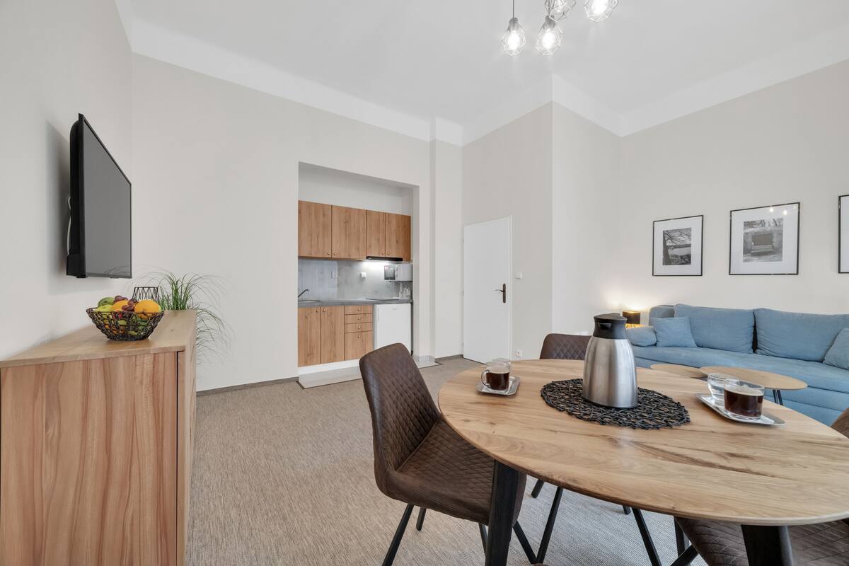 family room | in-room safe, desk, blackout curtains, iron/ironing board