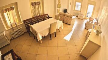 Panoramic Penthouse | Living area | 20-inch TV with satellite channels