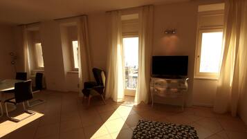Panoramic Penthouse | Living area | 20-inch TV with satellite channels