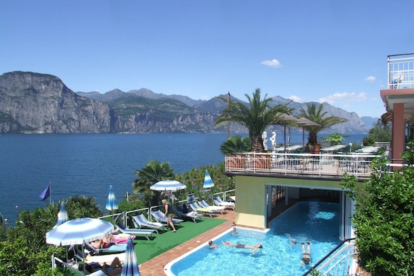 Indoor pool, seasonal outdoor pool, pool umbrellas, sun loungers